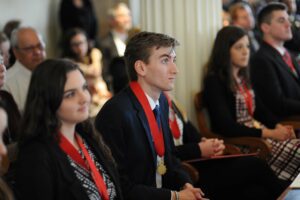Student Laureates listening to speeches